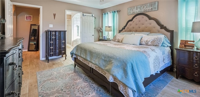 bedroom with light wood-type flooring