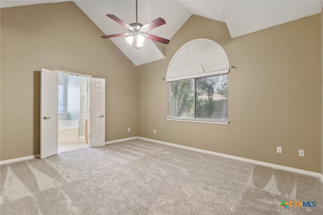 interior space with high vaulted ceiling, light carpet, and ceiling fan