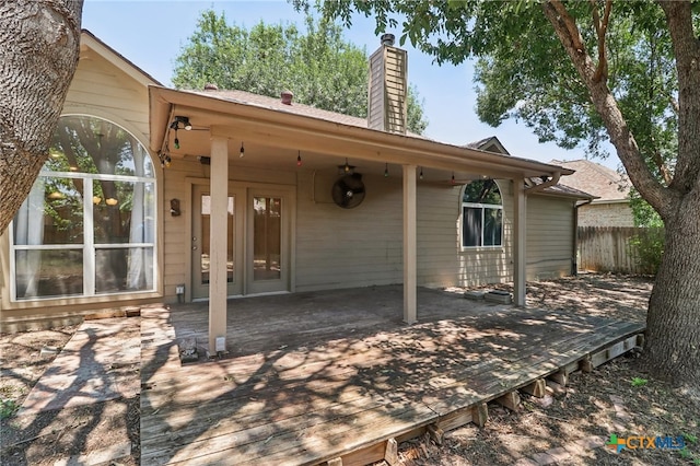 back of property featuring a deck