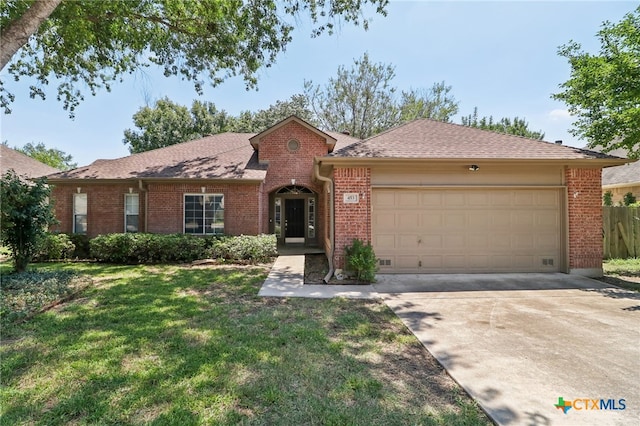 ranch-style house with a garage and a front lawn