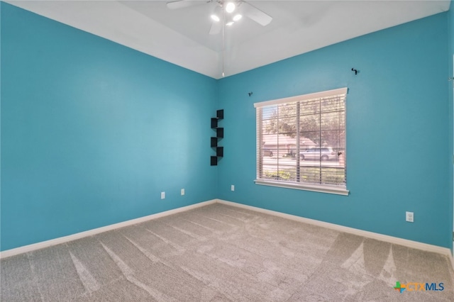 empty room with ceiling fan and carpet floors