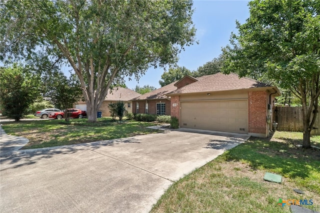 single story home featuring a garage and a front lawn