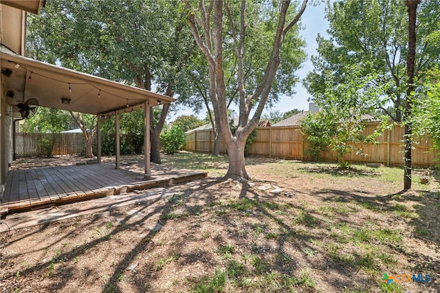 view of yard with a wooden deck