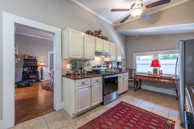 kitchen featuring lofted ceiling, light tile patterned floors, ceiling fan, crown molding, and appliances with stainless steel finishes