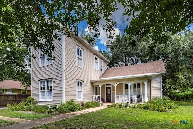 view of front of home with a front lawn and covered porch