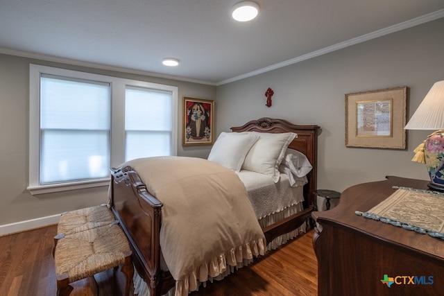 bedroom featuring dark hardwood / wood-style flooring and crown molding