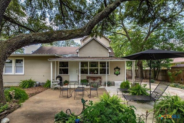 back of property featuring a patio area