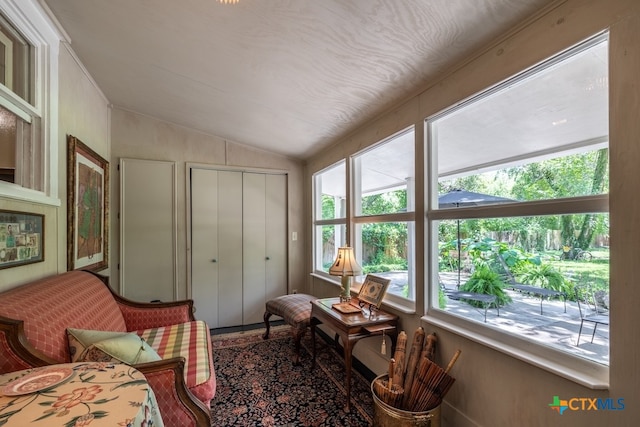 sitting room with vaulted ceiling