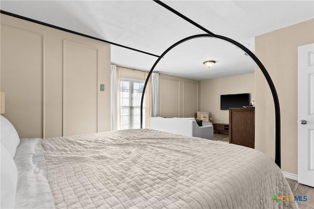 bedroom featuring hardwood / wood-style flooring