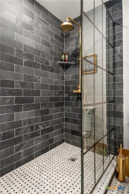 bathroom with a stall shower