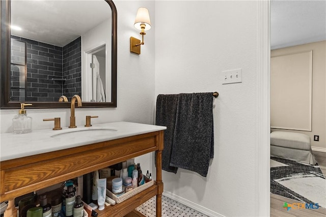 bathroom featuring vanity and baseboards