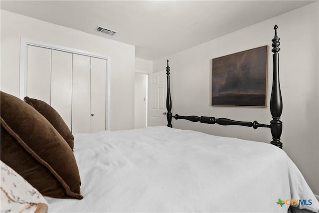 bedroom featuring a closet and visible vents