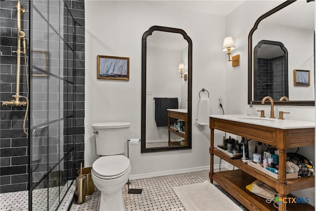 bathroom with a tile shower, sink, and toilet