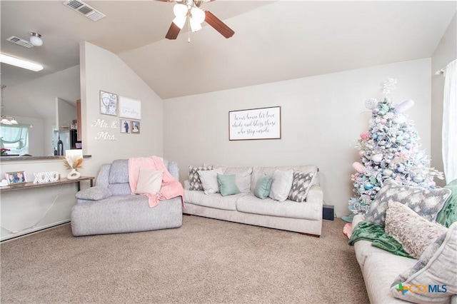 living room featuring carpet, visible vents, ceiling fan, and lofted ceiling