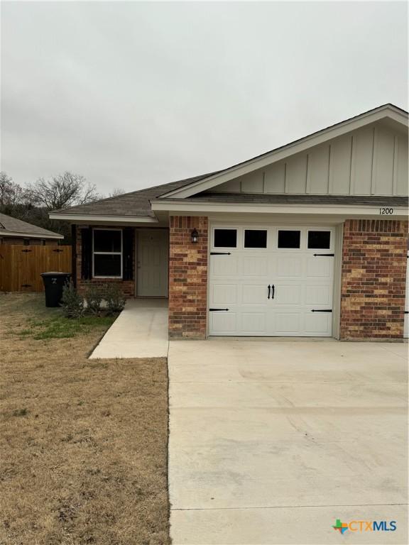 single story home with a garage