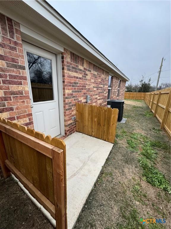 exterior space with a patio and central AC unit