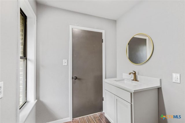 bathroom with vanity and wood finished floors
