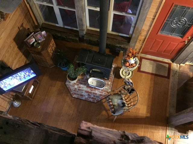 2911 Sulphur Wells Rd, Salado, TX 76571 - detailed view of wood walls, wood finished floors, and a wood stove