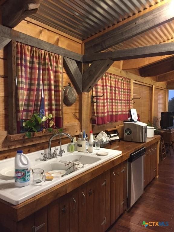 2911 Sulphur Wells Rd, Salado, TX 76571 - bar area with dishwasher, dark wood-type flooring, and wood walls
