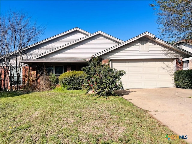 4709 Poppy Wood Cir, Killeen, TX 76542 - ranch-style house with a garage, brick siding, concrete driveway, and a front lawn