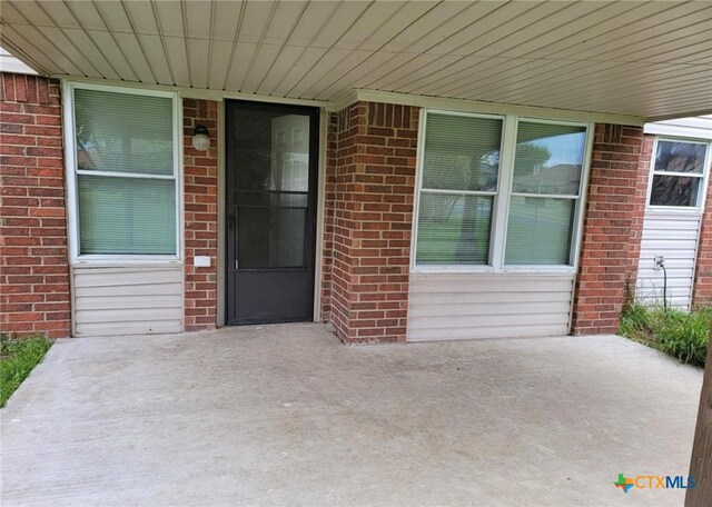 entrance to property with a patio area