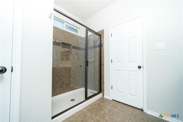 232 Pevero, Cibolo, TX 78108 - full bath featuring a stall shower, tile patterned floors, and baseboards