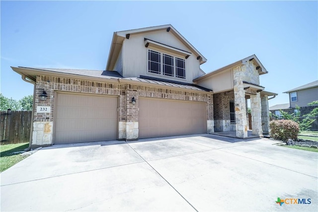 232 Pevero, Cibolo, TX 78108 - view of front of home with stone siding, driveway, and a standing seam roof