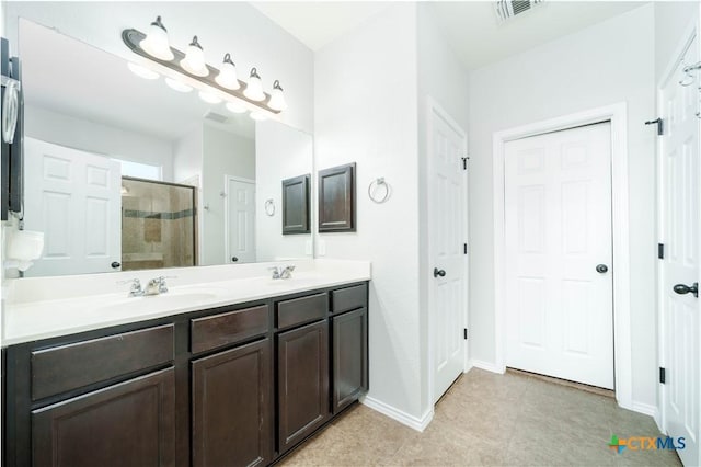 232 Pevero, Cibolo, TX 78108 - bathroom with a tile shower, double vanity, tile patterned floors, and baseboards