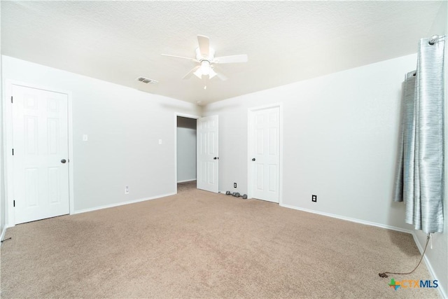 232 Pevero, Cibolo, TX 78108 - empty room with light colored carpet, ceiling fan, and baseboards