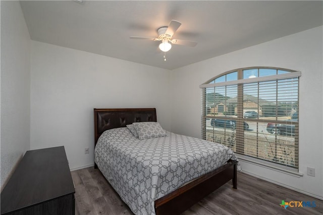 bedroom featuring ceiling fan and wood finished floors