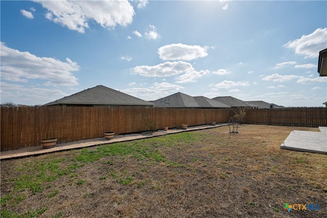 view of yard with a fenced backyard