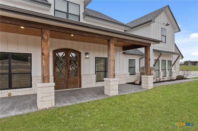 doorway to property featuring a yard