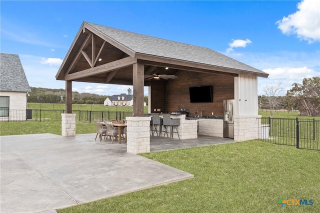 view of patio / terrace featuring a gazebo, exterior bar, and ceiling fan