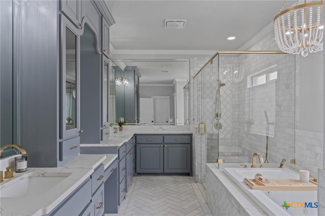 bathroom featuring vanity, a notable chandelier, ornamental molding, and plus walk in shower