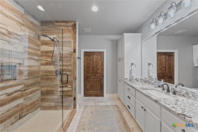 bathroom with vanity and an enclosed shower