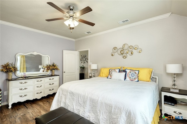 bedroom with ceiling fan, dark hardwood / wood-style flooring, and ornamental molding