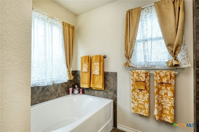 bathroom featuring a washtub