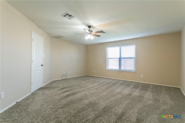 carpeted empty room featuring ceiling fan