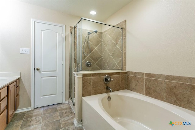 bathroom with plus walk in shower and vanity