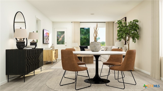 506 Bonzo Ct, Jarrell, TX 76537 - dining room with baseboards and light wood-style flooring