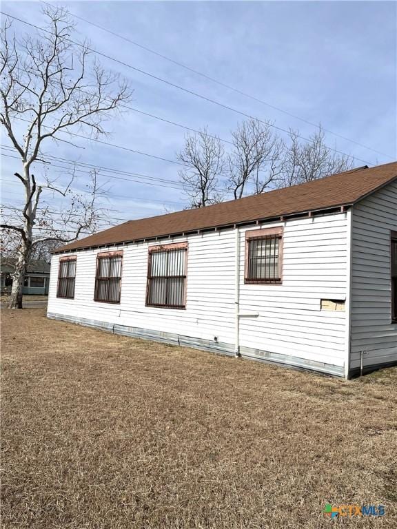 view of home's exterior with a lawn