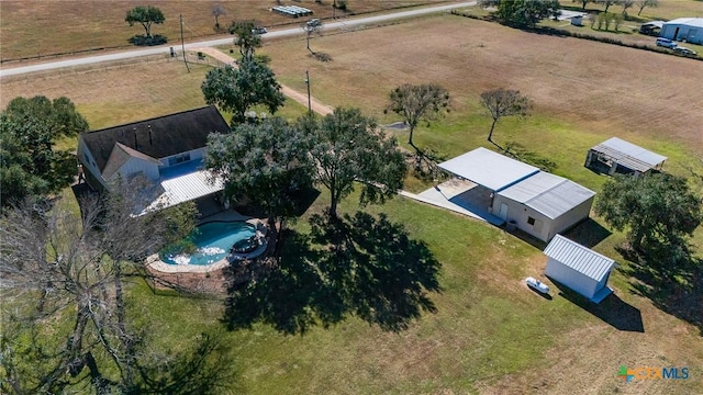 birds eye view of property with a rural view