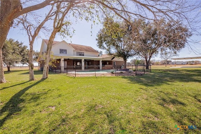 view of yard with a fenced in pool