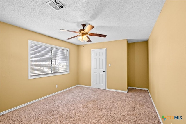 empty room with carpet floors and ceiling fan