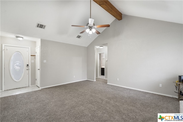 unfurnished living room featuring lofted ceiling with beams, light colored carpet, and ceiling fan