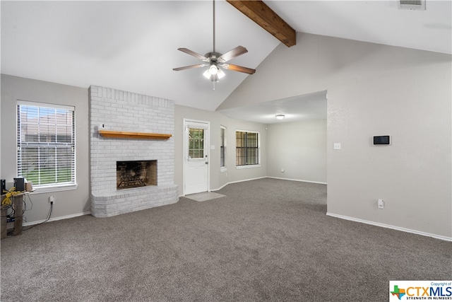 unfurnished living room featuring ceiling fan, beam ceiling, high vaulted ceiling, a fireplace, and carpet floors