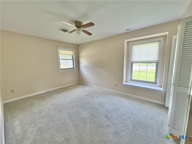2602 Miori Ln, Victoria, TX 77901 - carpeted spare room featuring a ceiling fan and baseboards