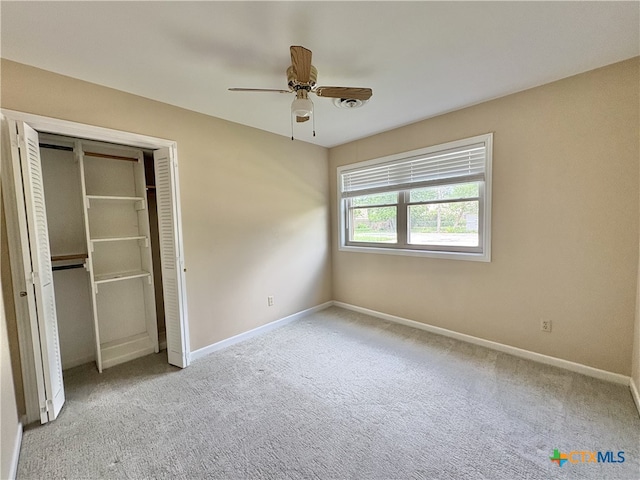 2602 Miori Ln, Victoria, TX 77901 - unfurnished bedroom with carpet floors, baseboards, a closet, and ceiling fan