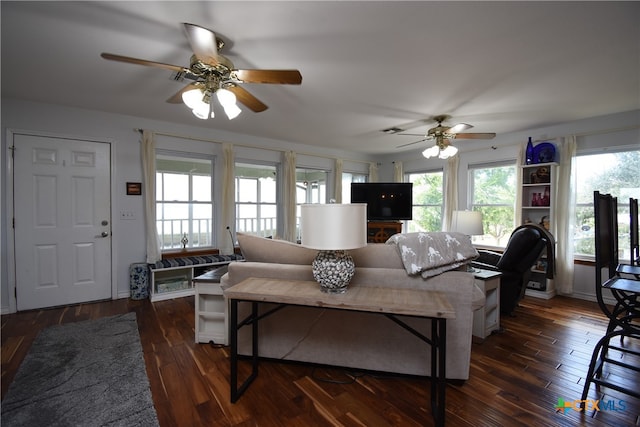 living room with ceiling fan and dark hardwood / wood-style floors