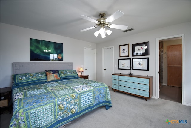 carpeted bedroom featuring ceiling fan